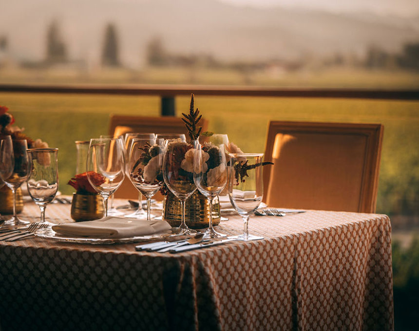 A view from Opus One over the vineyards with table set in for ground
