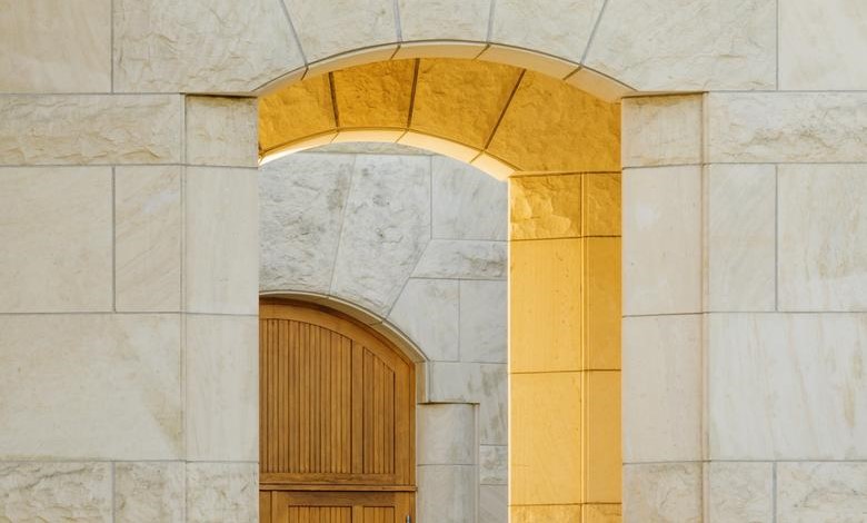 Opus One limestone and redwood front door