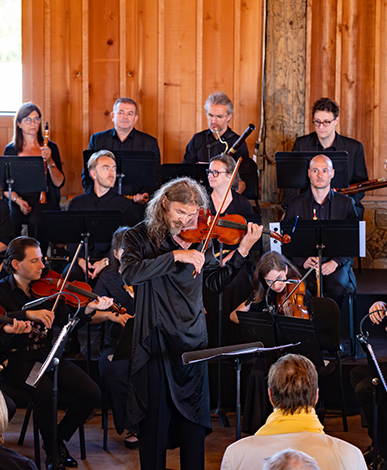 Musician performing the violin at Opus One Premieres